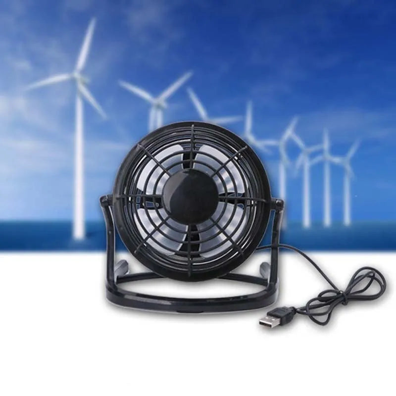 Mini adjustable USB desk fan in black, showing compact square design and angled breeze outlet