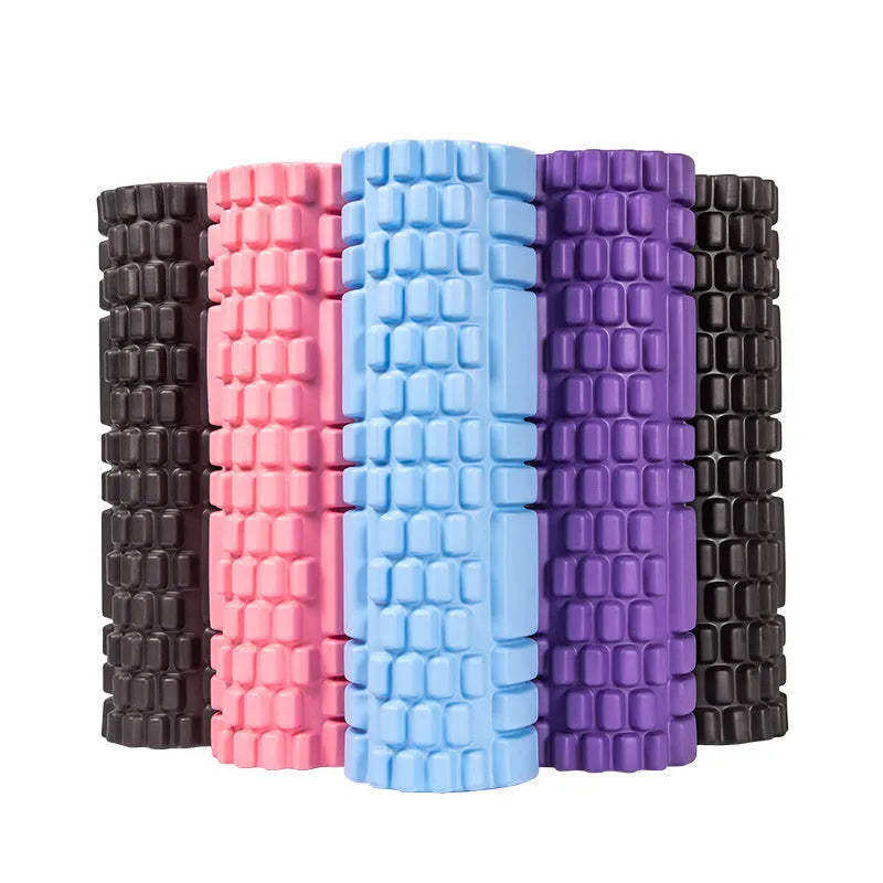 EVA foam roller for fitness in black, shown on a wooden floor.