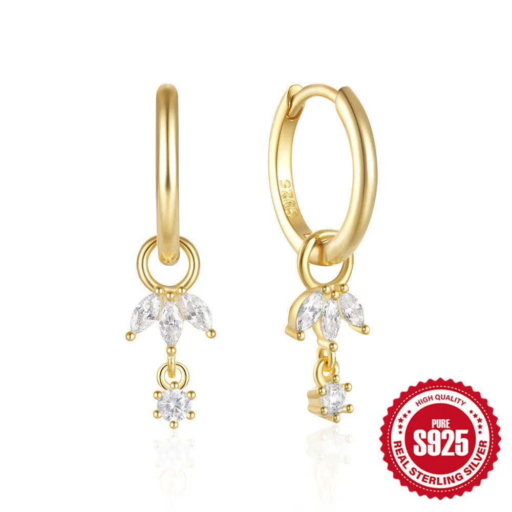 Golden geometric sunflower earrings made from sterling silver with inlaid zircon stones.