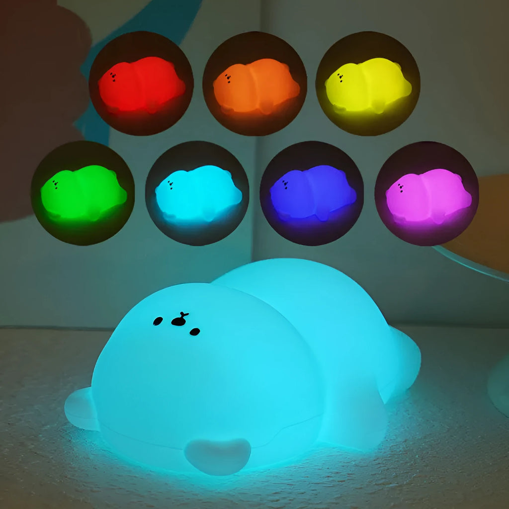Lying flat bear silicone small night lamp with three-gear dimming and RGB colour switching on a bedside table