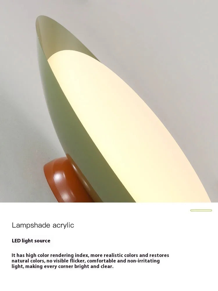 Modern cream style flying saucer ceiling lamp with curved iron shade in mint green.