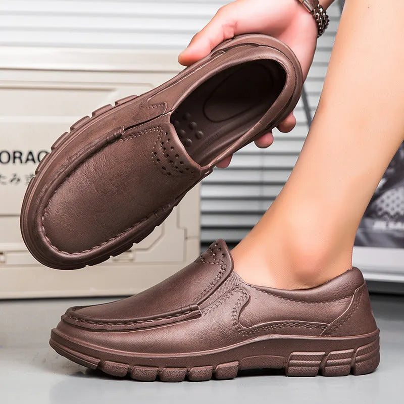 Men's black slip-on casual shoes with a waterproof platform sole and round toe.