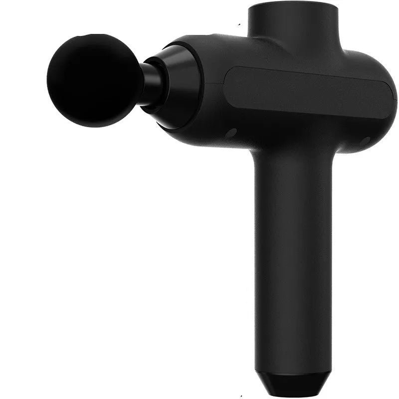 Handheld black muscle massager with six different coloured massage heads on a table.