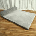 Corduroy dog sofa bed with bolster sides in grey colour on wooden floor