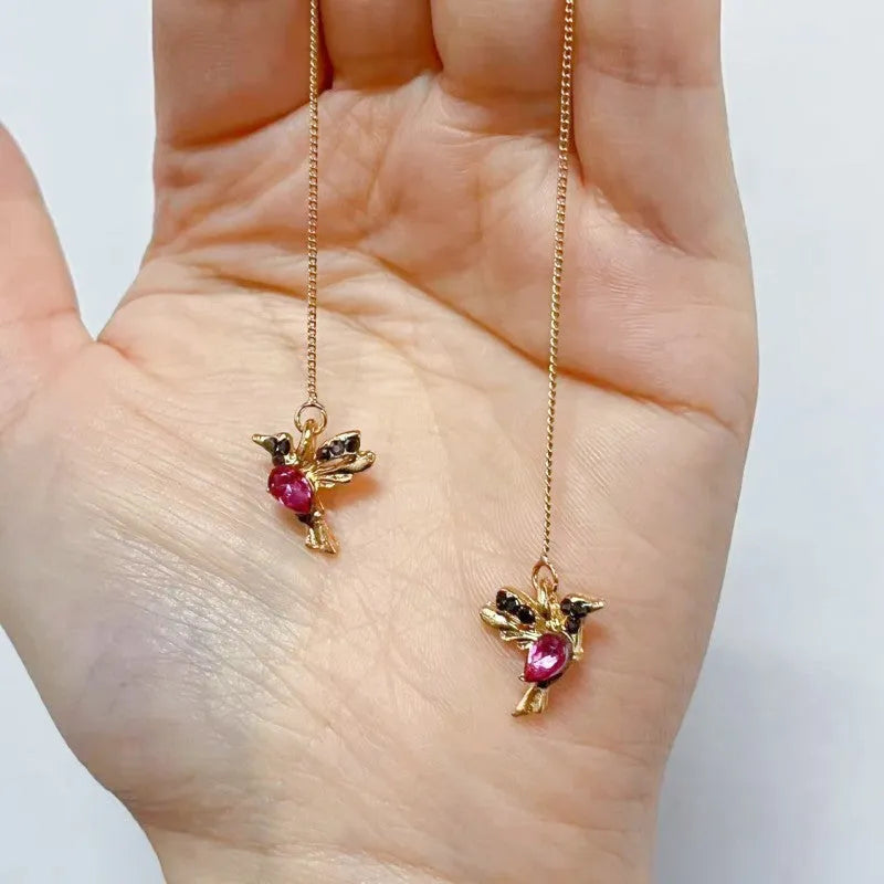 Women's long bird hanging earrings in alloy with blue electroplated finish.