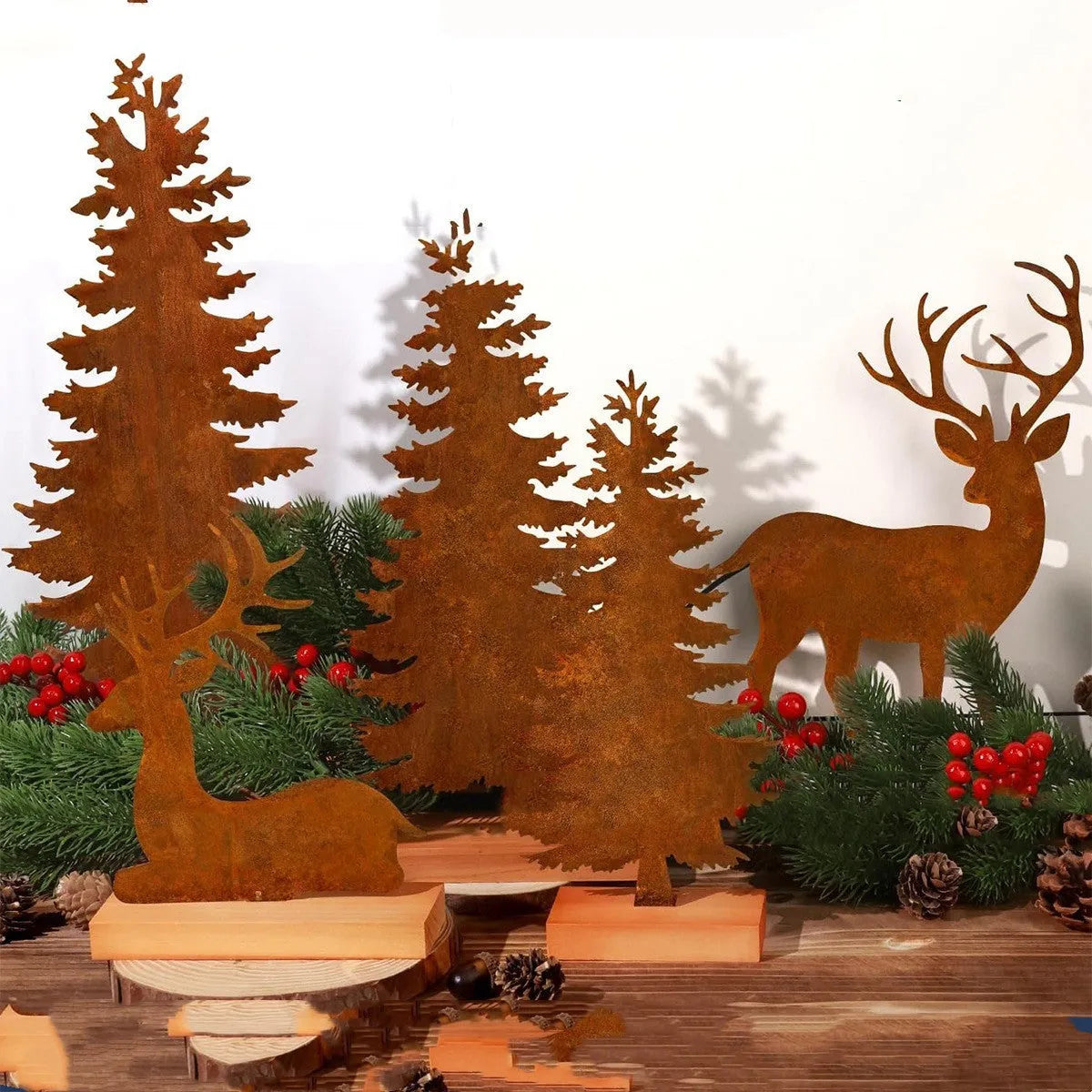 Set of three rustic metal Christmas decorations featuring elk and tree figures