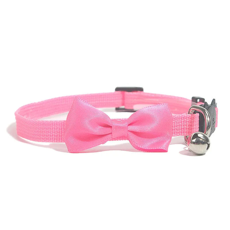 Adjustable nylon cat bow collar with a bell in a striped pattern, shown in a bright colour.