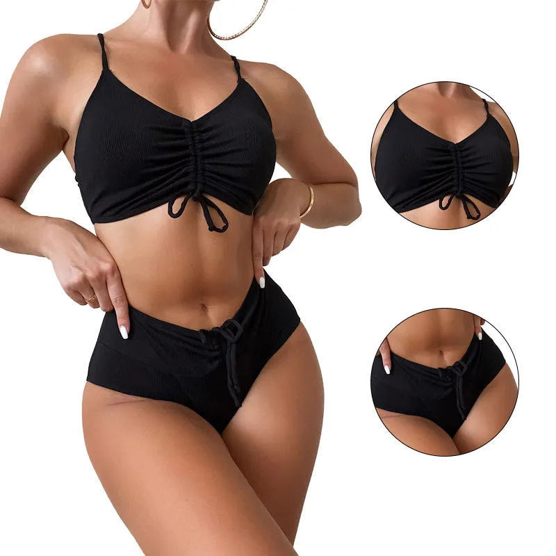Black women's bikini swimsuit with high waist shorts and a sleeveless top on a mannequin.