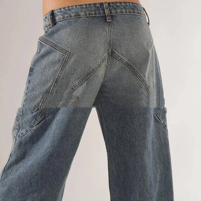 Blue loose fit wide leg mop trousers with low waist and straight leg cut on a person.