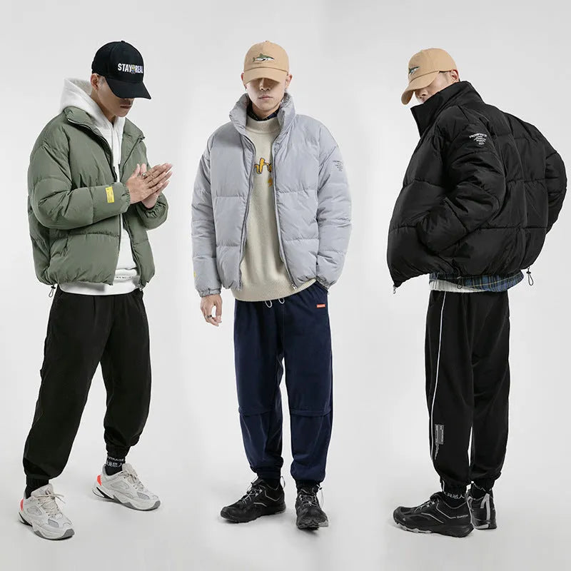 Men's stand collar padded jacket with zip front, side slit pockets, and straight hem in black, green, or grey.
