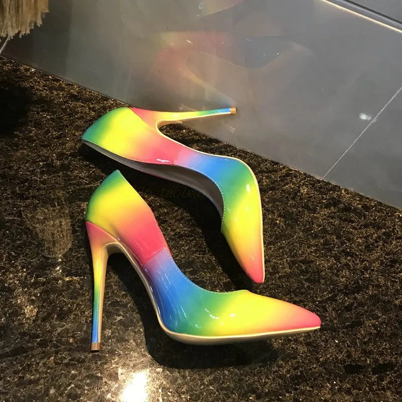 Rainbow glossy patent leather women's ultra-high heel shoe with pointed toe and thin heel.