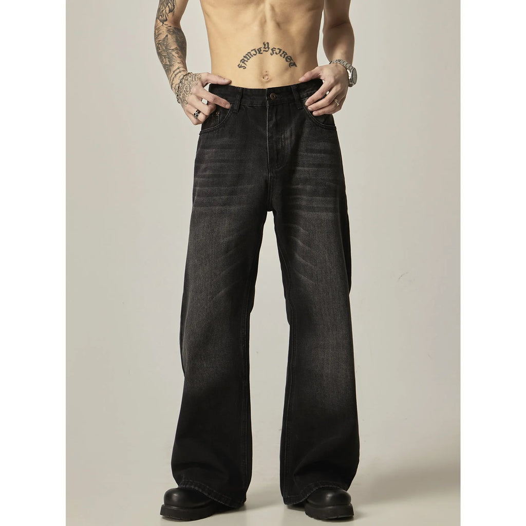 Black loose-fit straight-leg retro jeans with a zipper fly on a mannequin