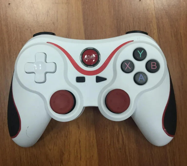 Upgraded X3 black and white Bluetooth wireless game controller for Android phones with cellphone clip attached.