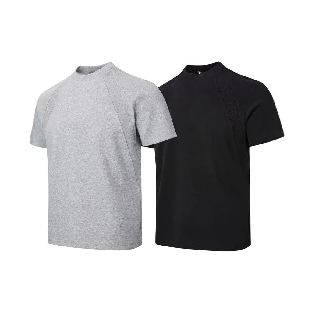 Man wearing a loose-fit black short sleeve top with visible air layer stitching detail.