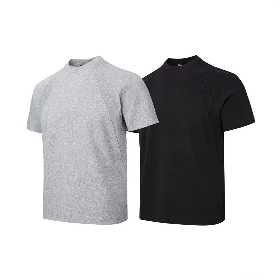 Man wearing a loose-fit black short sleeve top with visible air layer stitching detail.