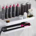 White double-layer aluminium punch-free bathroom storage rack holding a curling iron and hairdryer.