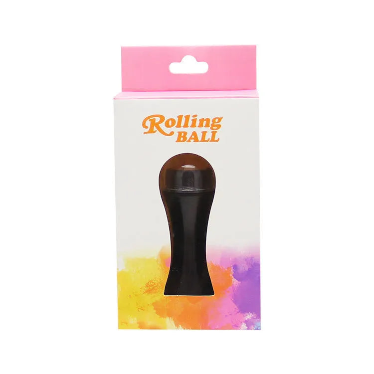 Volcanic stone oil-absorbing facial roller in pink on a white background