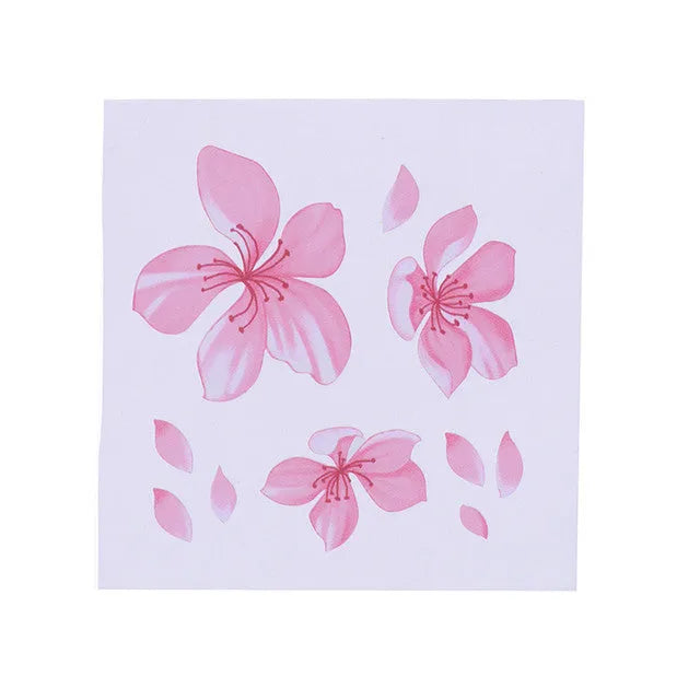 Close-up of a cherry blossom flower pattern on a PVC car sticker, shown with a peel-off backing.