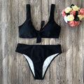 Women's solid colour bikini set with sleeveless top and matching briefs in polyester fabric