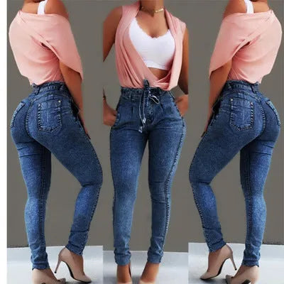A pair of grey fringed jeans made from Cowboy fabric, showing Western-inspired fringe detail along the bottom hem.