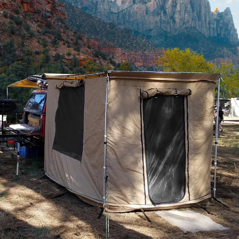 Camouflage two-bedroom camping tent with aluminium poles set up outdoors.