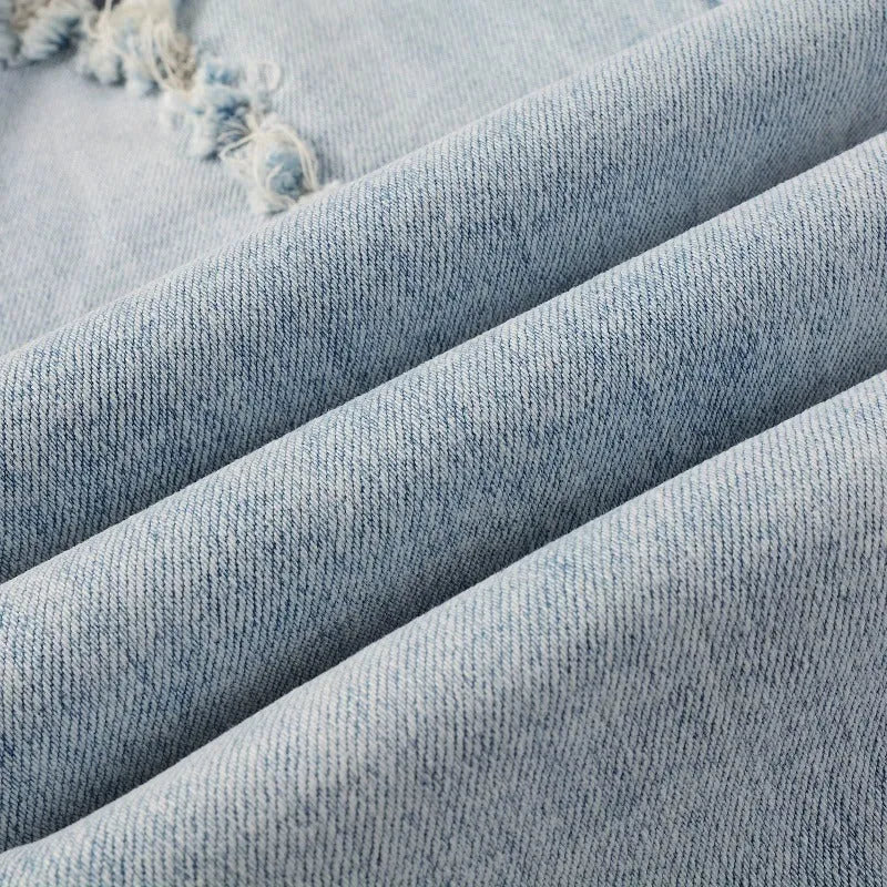Light blue elastic tight fit jeans for men with patchwork and cat whisker finish