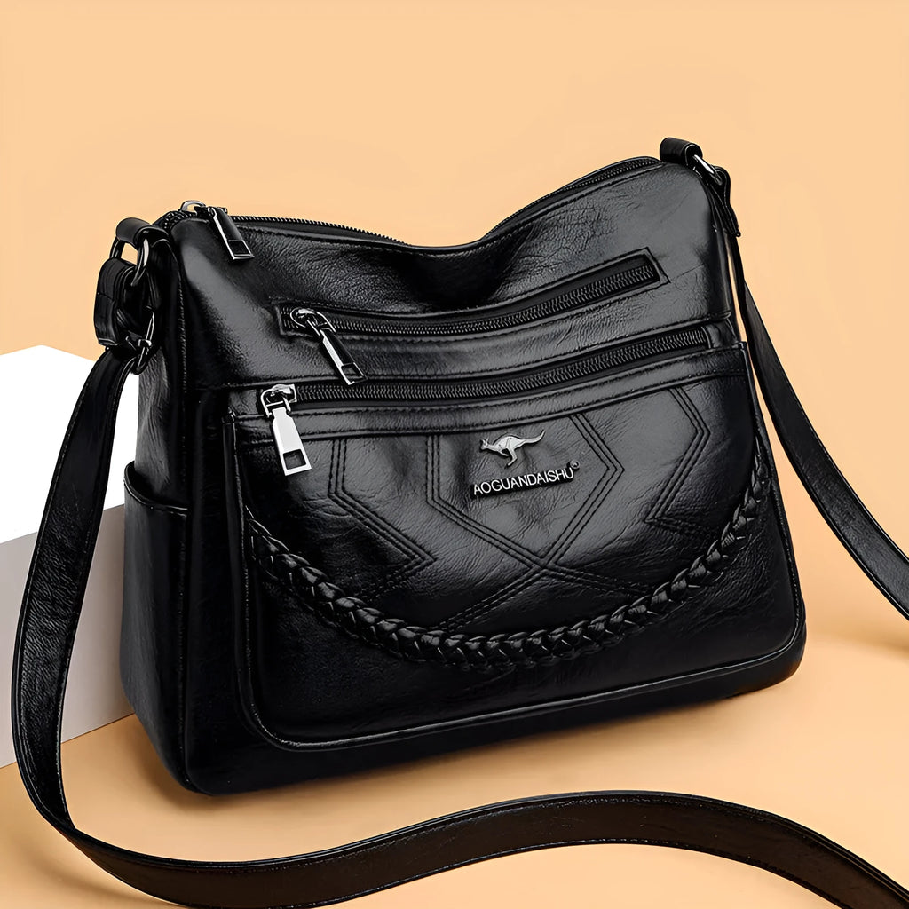 Soft leather shoulder bag in horizontal square shape with large capacity and internal zipper compartment