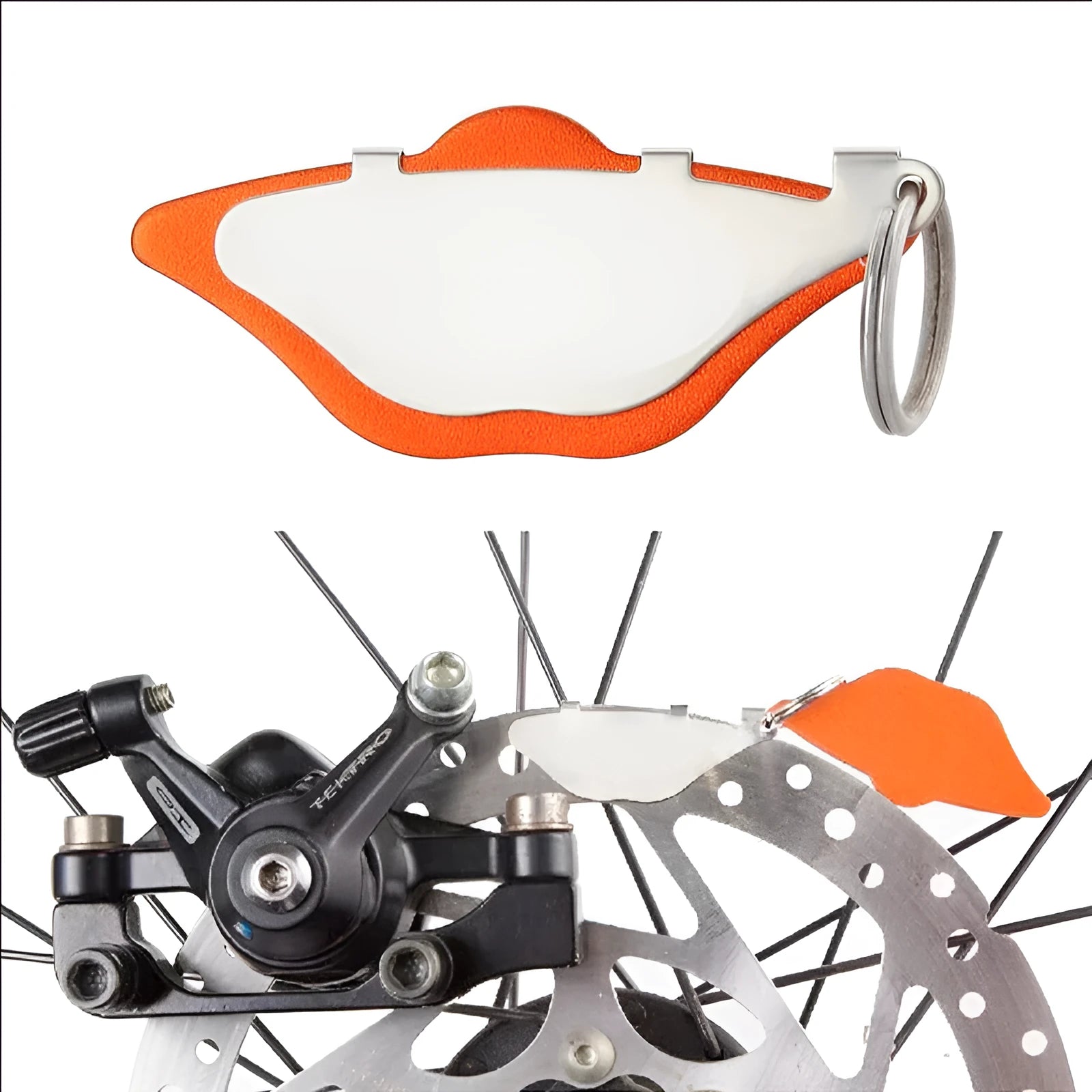 Black and orange mountain bike brake pads with scratch-proof metal linings and adjustment flap