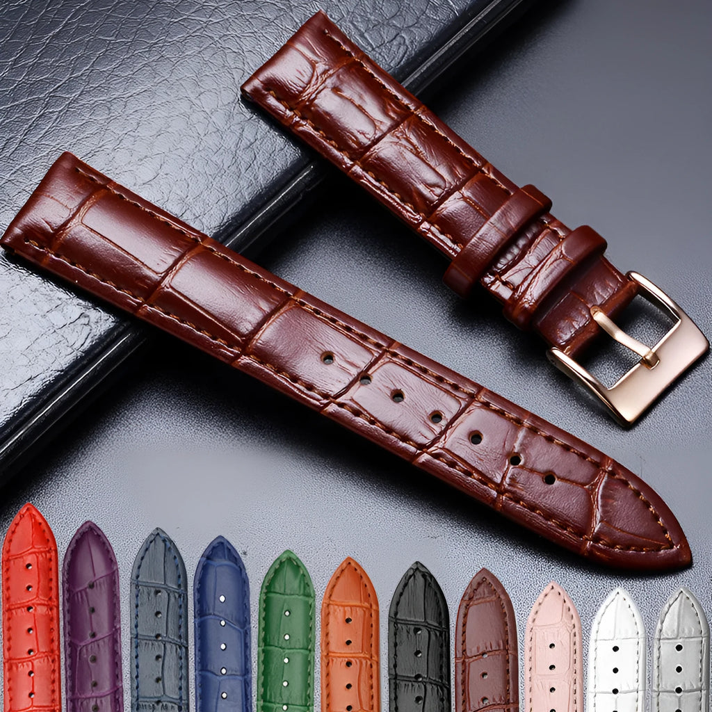 Blue genuine leather watch strap with bamboo cowhide finish and silver stainless steel pin buckle on a neutral background