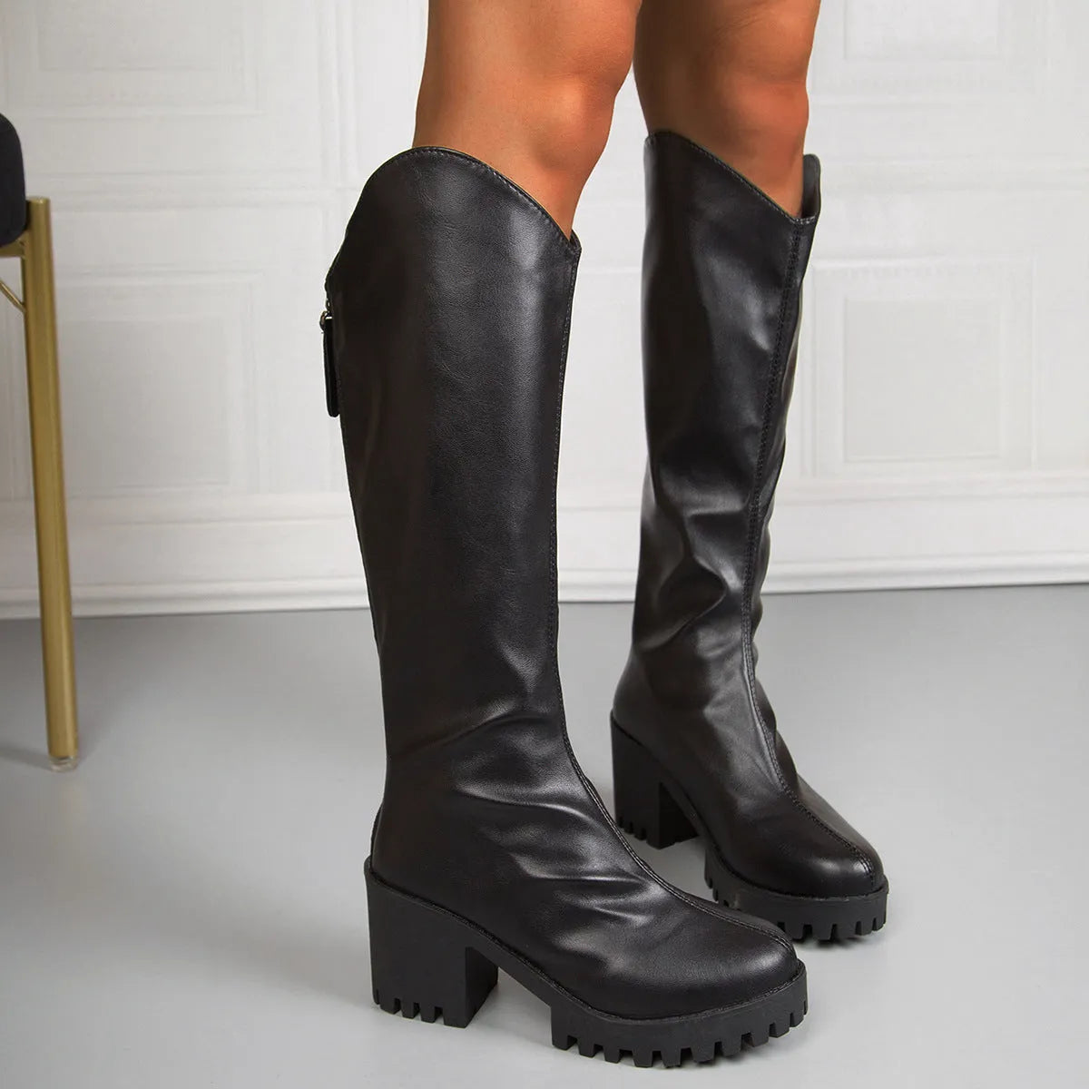 Black knee-high boots with chunky 6-8cm heel, back zipper, round toe, and rubber sole