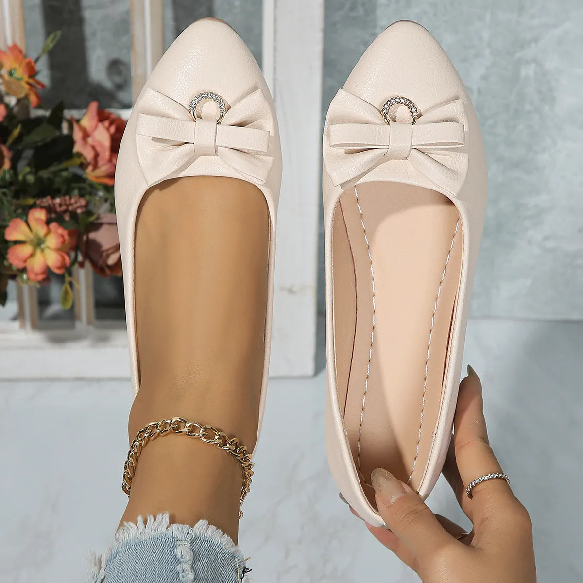 Women's beige flat casual shoes with a bowknot on the shallow mouth and a round toe.