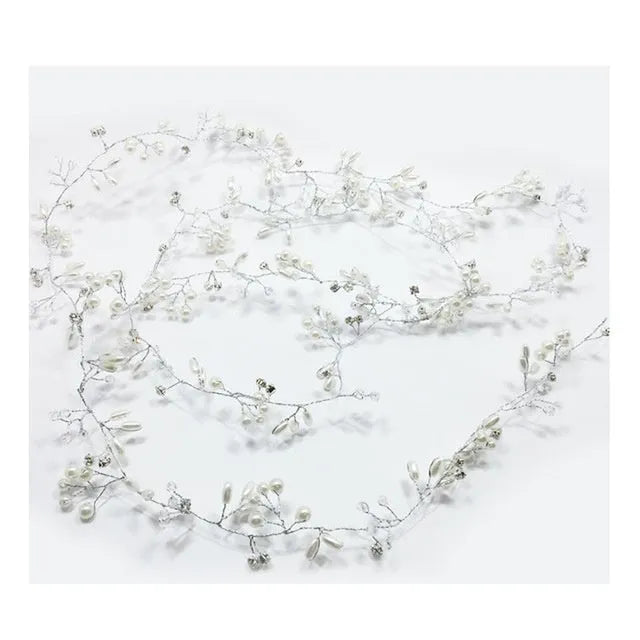 Long silver wire hair band with crystal and pearl decorations for bridal hairstyling.
