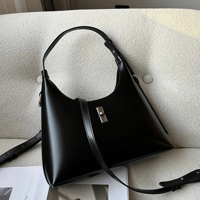 Soft genuine leather crossbody shoulder bag in a dumpling shape, shown in one of six available colours.