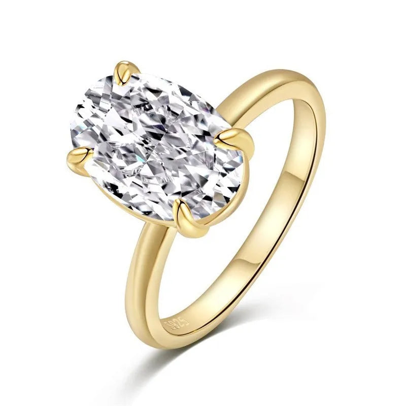 Gold or silver oval women's ring with a four-claw setting holding a hand-cut stone.