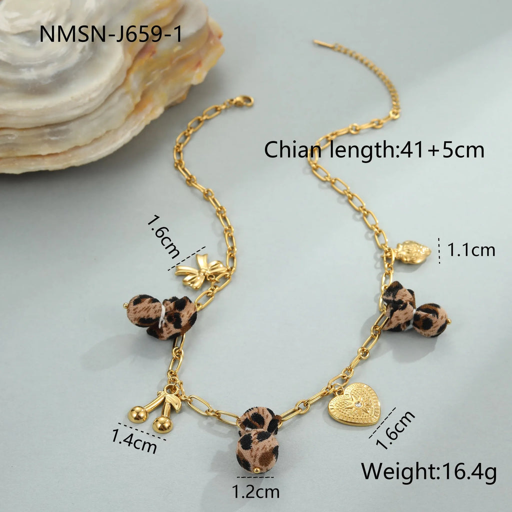 Leopard and love heart flowers pendant necklace on a stainless steel chain with gold electroplating.