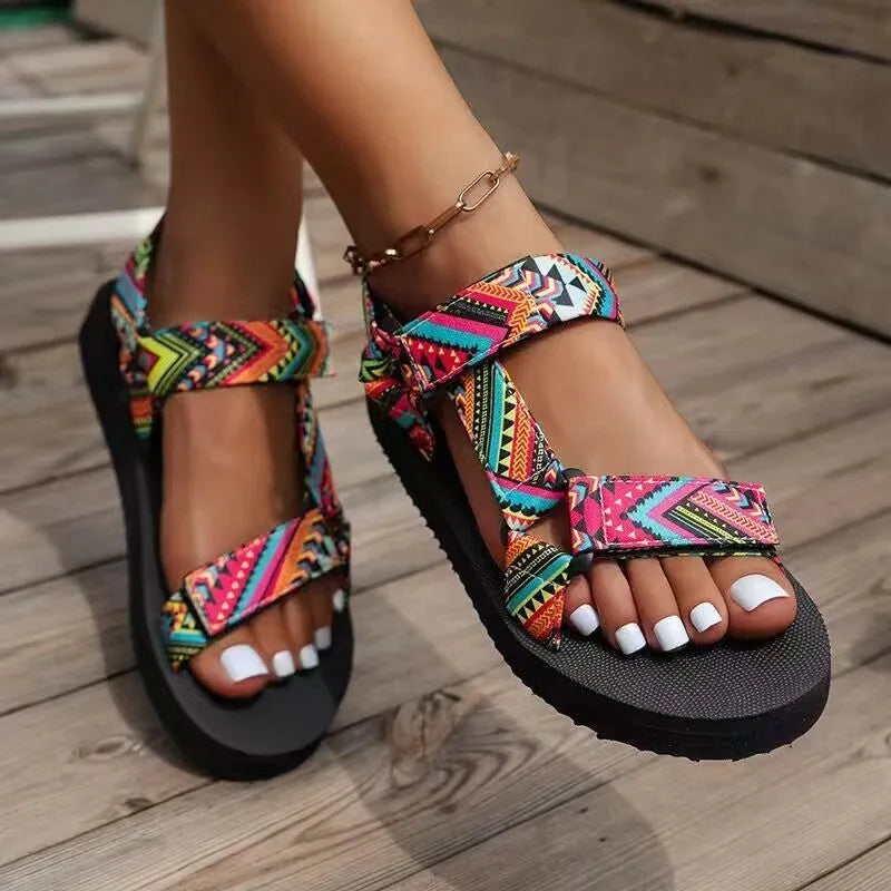 Women's ethnic print flat sandals with Velcro webbing strap and foam sole in blue and red colourways