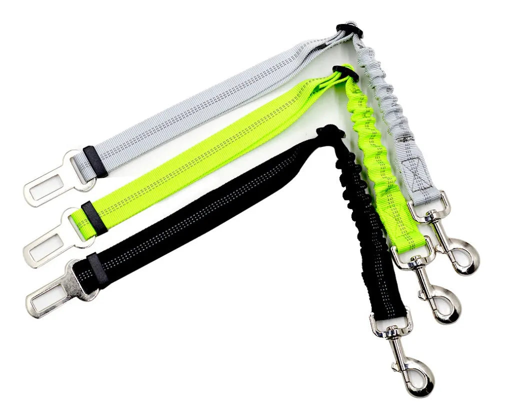 Black adjustable dog seat belt with reflective safety rope attached to car seat belt buckle, polyester webbing and alloy joint visible