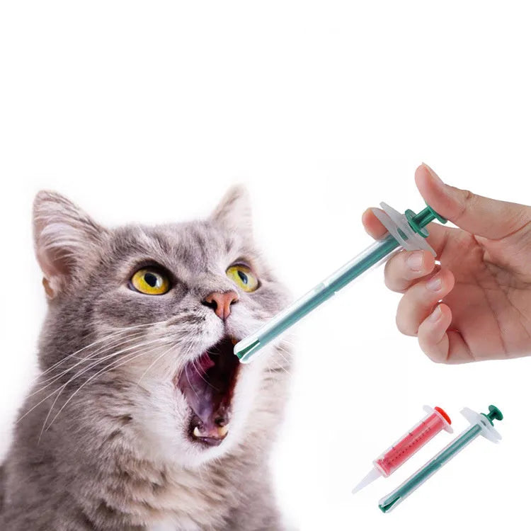 Two pet pill shooter syringes with soft tips, one larger and one smaller, for administering medication to cats and dogs.