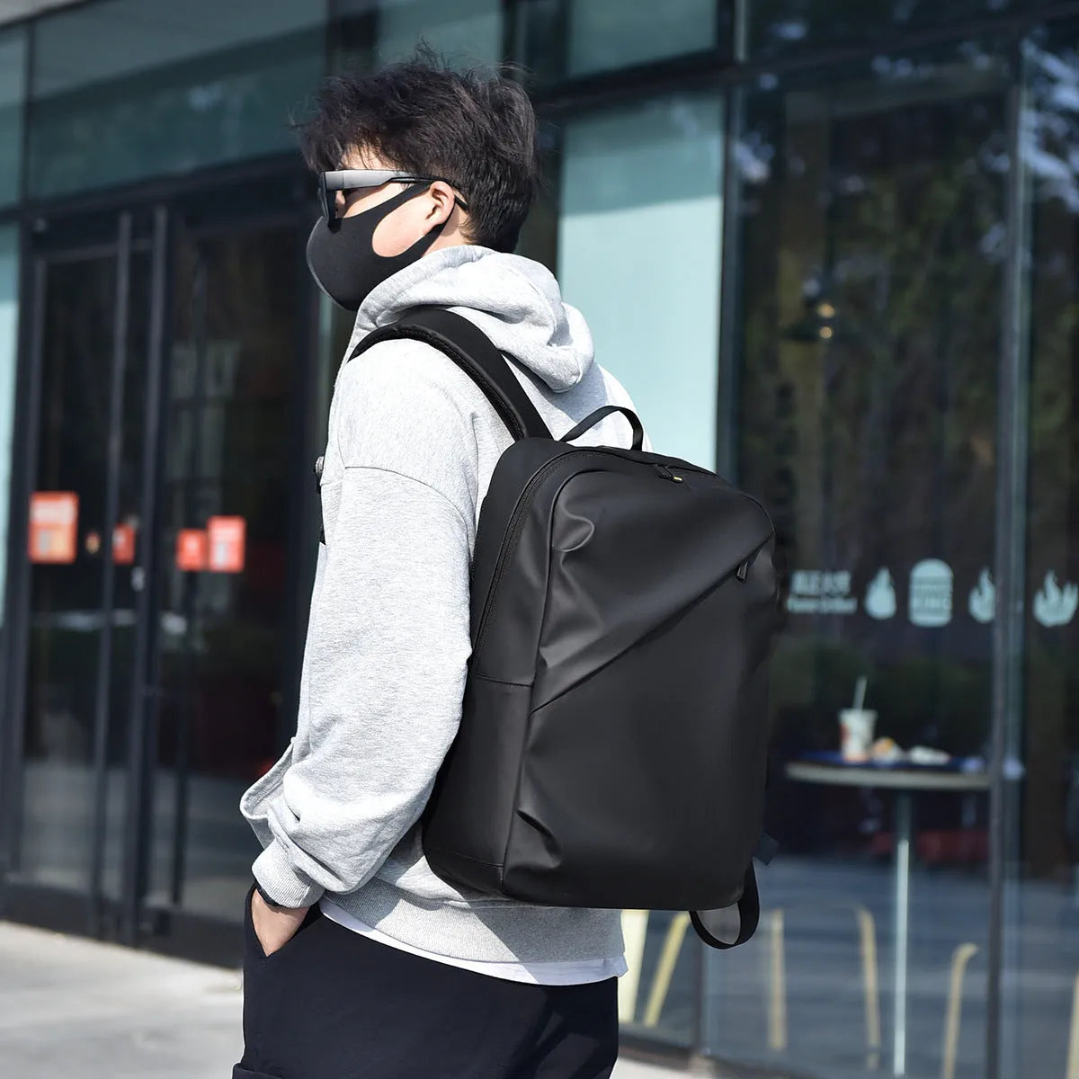 Large black waterproof PU leather backpack with sewing thread detailing