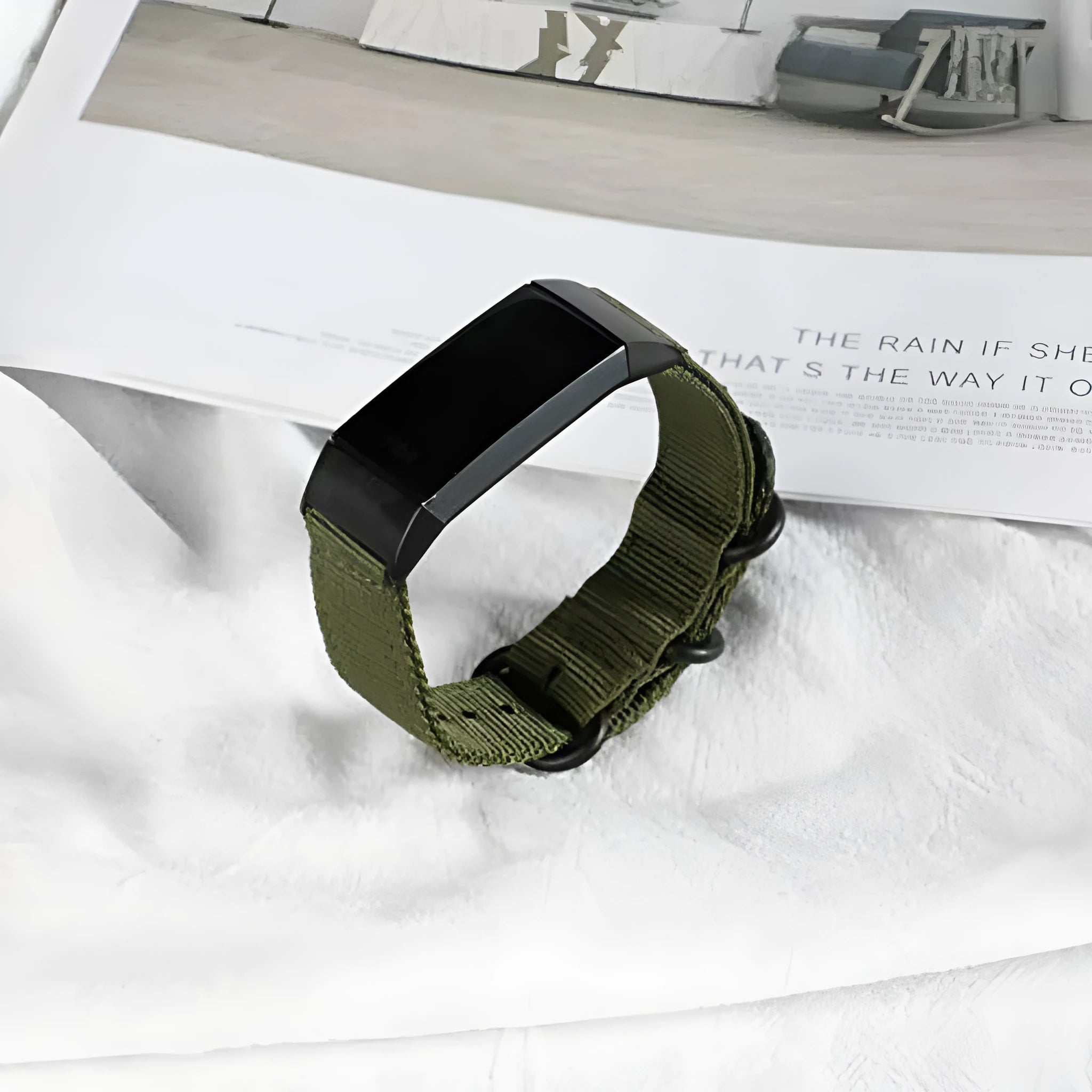 Army Green nylon replacement strap with a three-ring metal buckle for a Fitbit Charge 3 or Charge 4 fitness tracker.