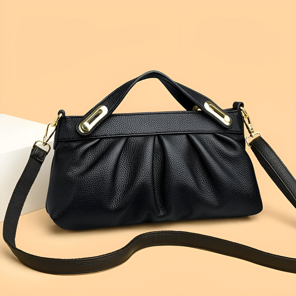 Genuine leather crossbody bag with pleated shoulder strap, horizontal square shape, available in six colours including black, khaki, green, beige, blue, red