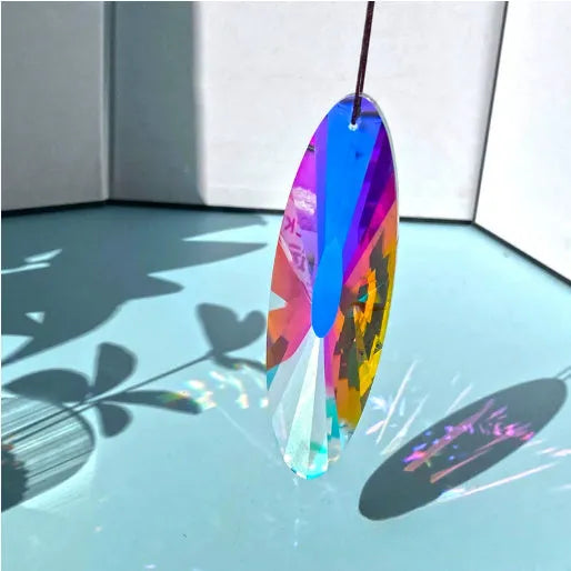 Rainbow coloured electroplated crystal decorative ornament in a tree shape for garden or indoor display.