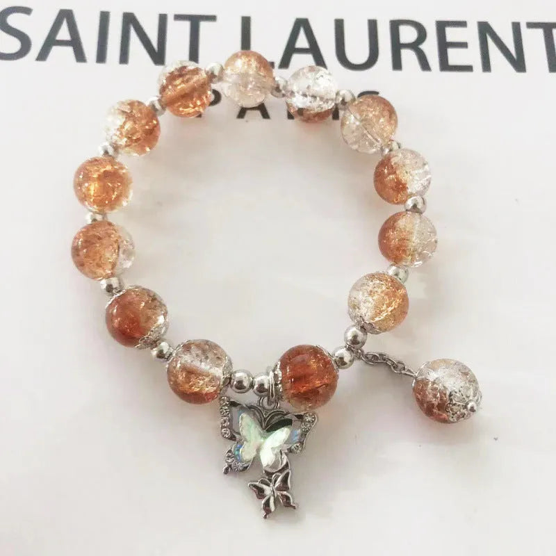 Chinese style glass bead bracelet with bamboo leaf design and manual craftsmanship details.