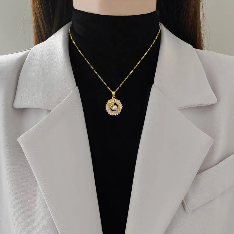 Geometric fashion jewellery set with gold plated copper detailing on titanium steel chain