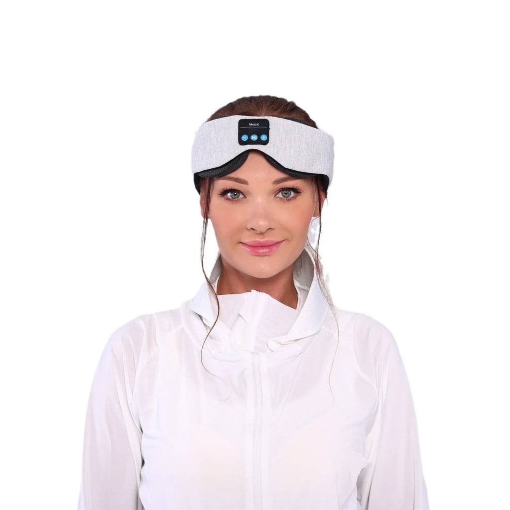 Grey polyester Bluetooth sleeping eye mask with long eyelashes design and no pressure fit.
