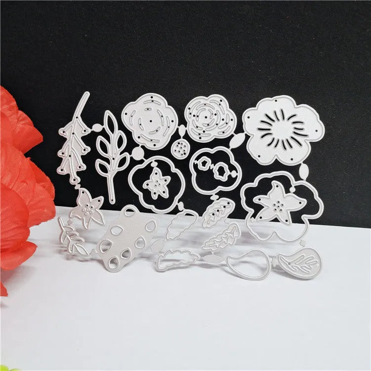 Silver carbon steel cutting die with plant design pattern measuring 14.3 by 9.9 cm