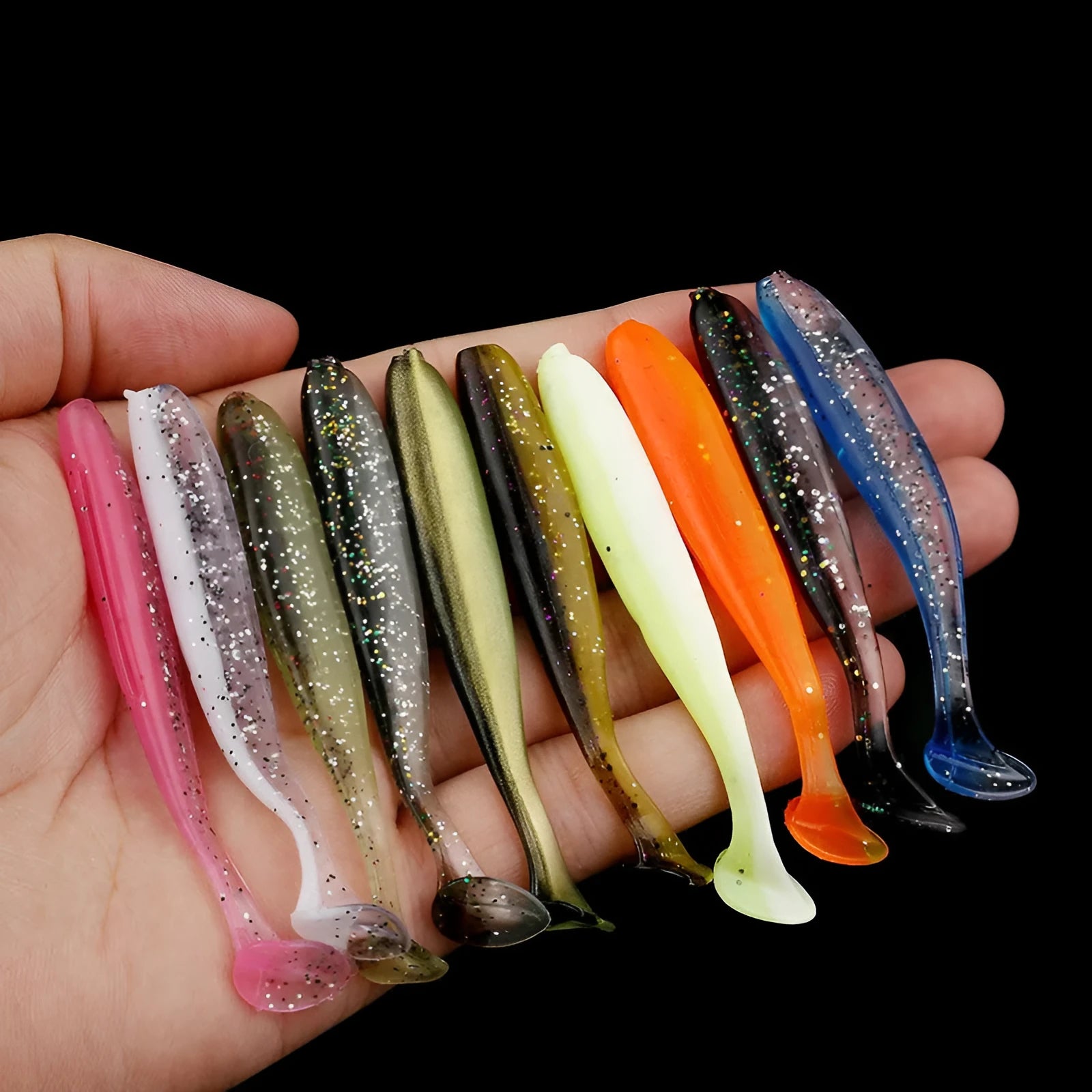 Soft worm mandarin fish topmouth culter fishing lure showing two-tone colour and T-tail, 7cm long.