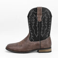 Men's black square toe western motorcycle boots with a low wedge heel and mid-calf height.