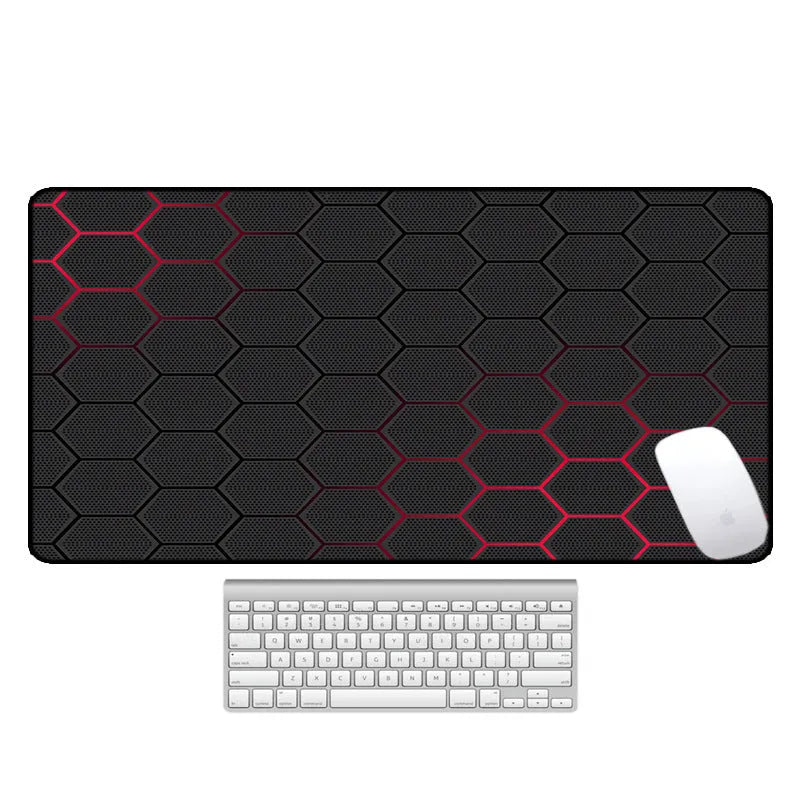 Large patterned desk mat for mouse and keyboard on a wooden desk.
