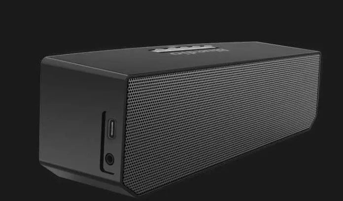 Black BS-6 cloud smart speaker with compact rectangular design on a surface.